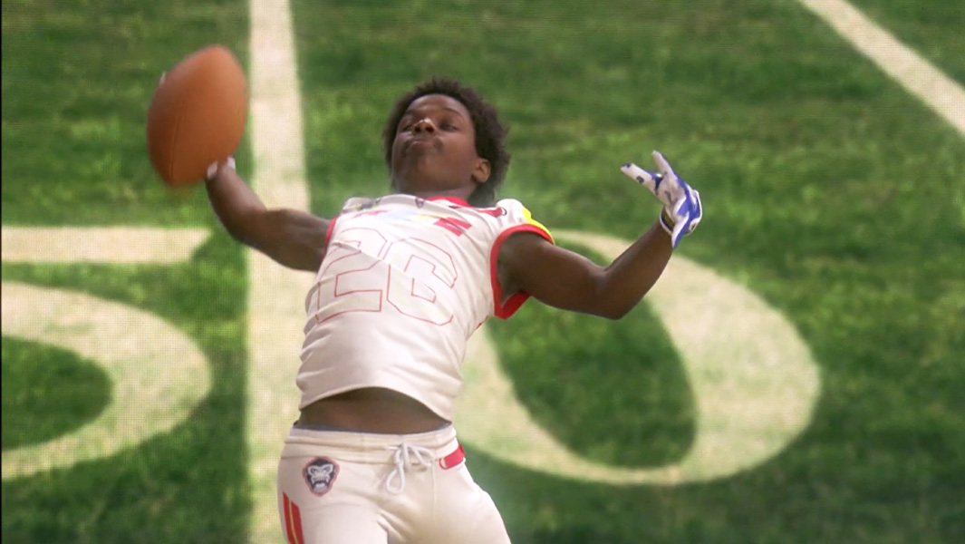 Learn how to throw an American football by a record-breaking athlete!