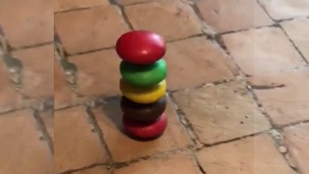 He can stack five M&Ms on top of each other! 