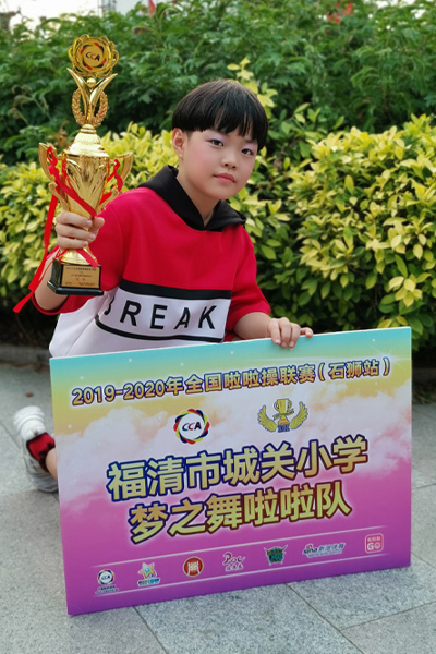 Wang posing with trophy