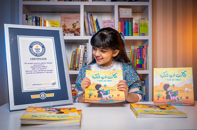 aldhabi with her book and record certificate