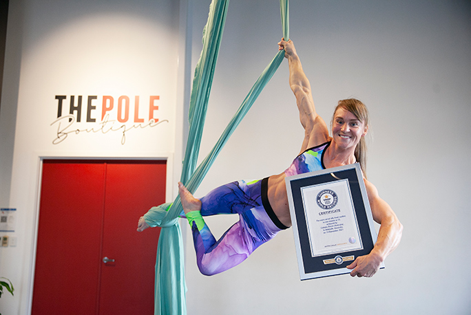 Celeste with certificate smiling