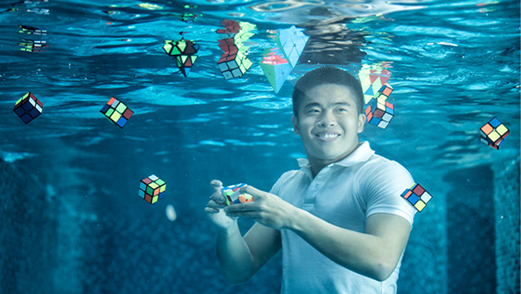 Daryl Tan can solve puzzle cubes underwater, upside down and while running