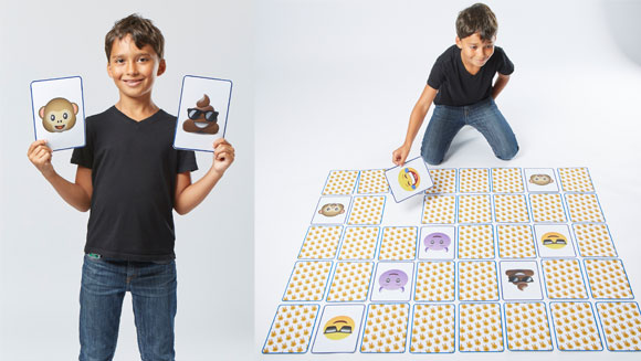  boy holding cards with Emoji 