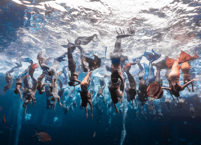 all mermaids are getting into the water