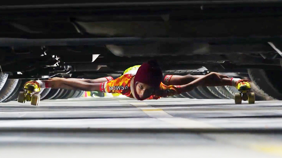 deshna-nahar-limbo-skating-under-twenty-cars-721585