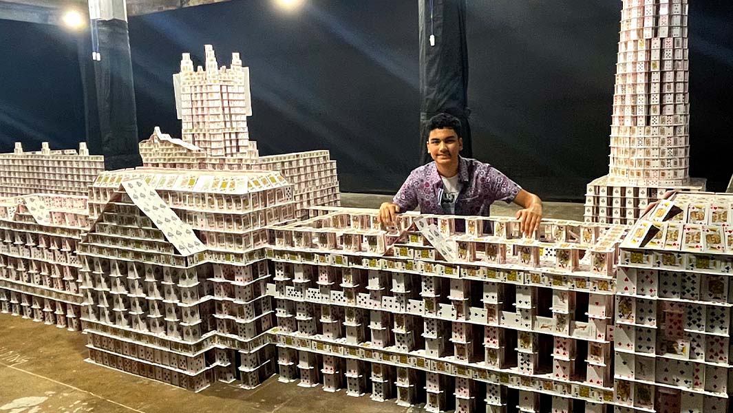Arnav standing inside card structure