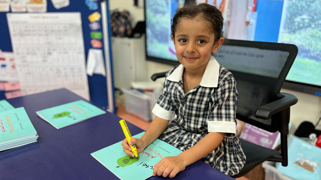 youngest author signing her book