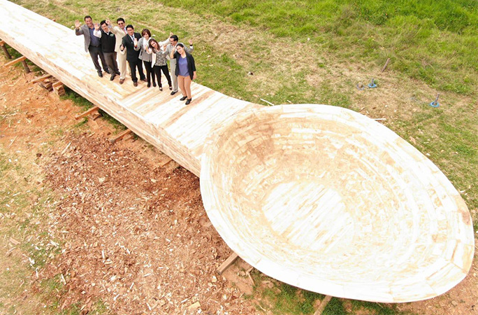 Largest spoon with people sitting on it