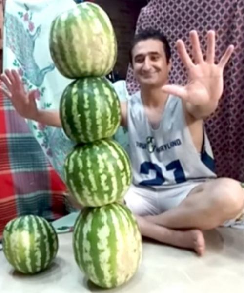 four watermelons stacked vertically