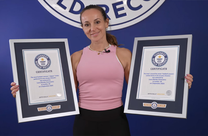 laura holding two record certificates