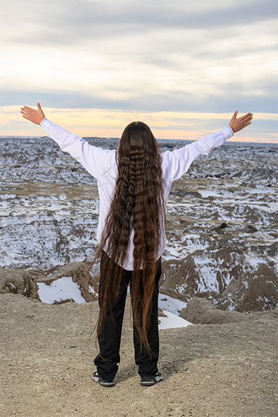 reuben from behind with hands up