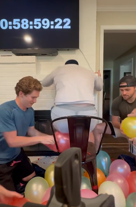 man sitting on balloon