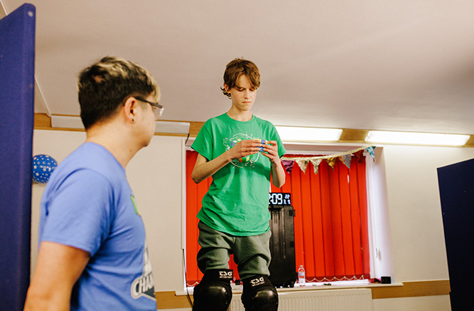 Micah solving puzzle cube