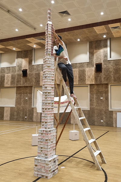 Arnav on ladder building tower