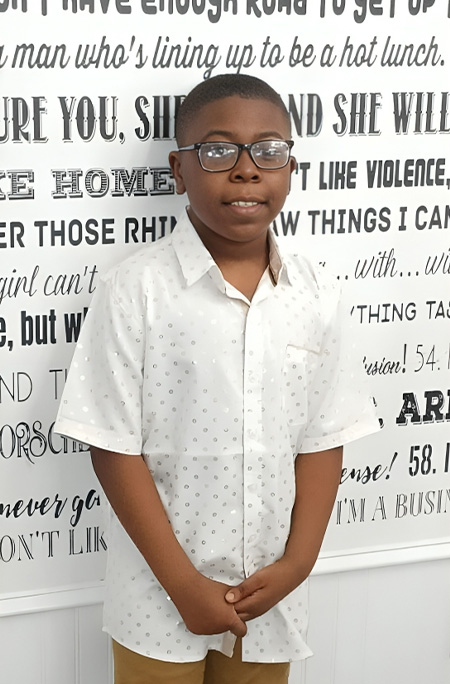 Caleb in front of wall