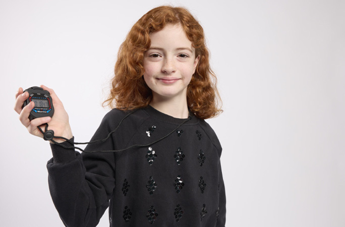 Girl holding stopwatch