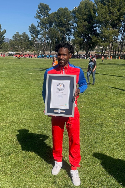 winner holding record certificate