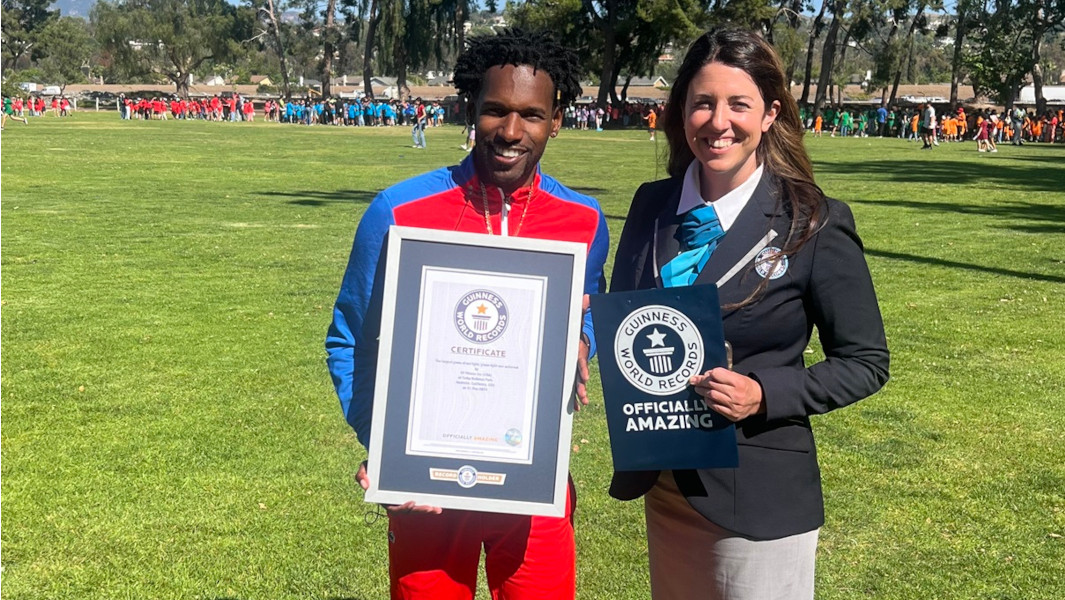 winner and adjudicator holding record certificate