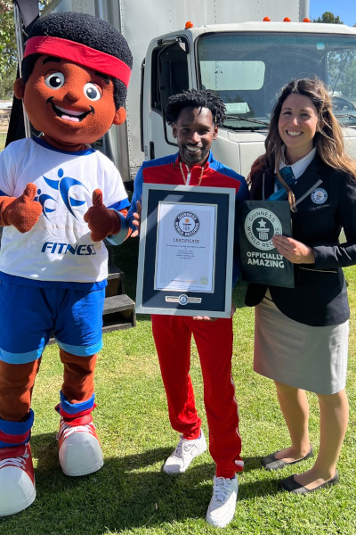 Winner with adjudicator and mascot