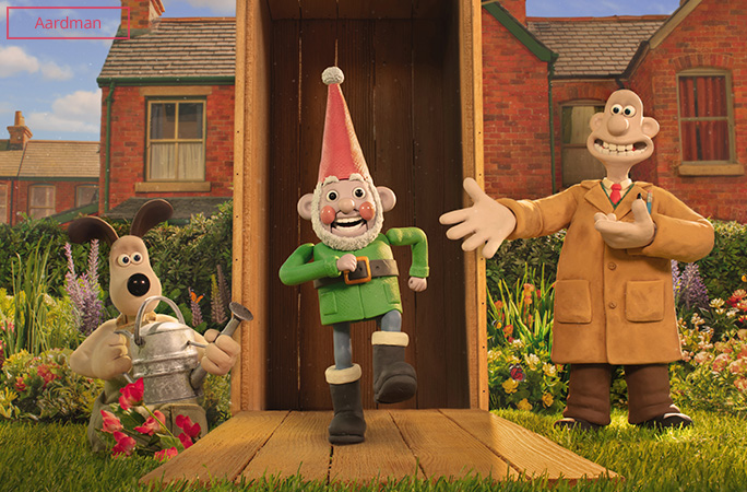 Wallace and Gromit unboxing Norbot the robot gnome in their garden