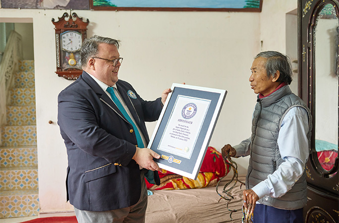 Craig giving record certificate