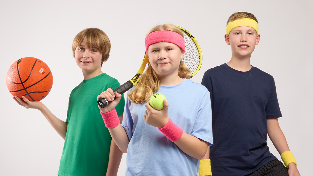 Three sporty kids posing