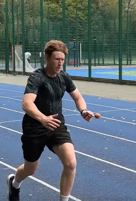 man running with egg