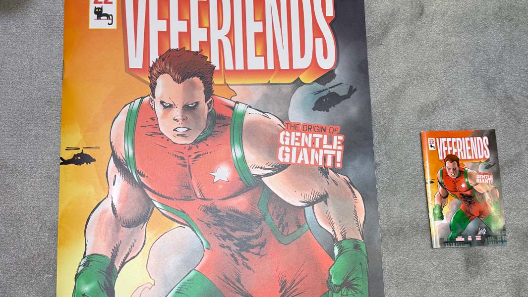 split image large comic book next to regular size and NYCC