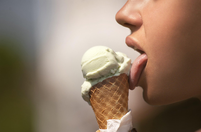 kid licking ice cream