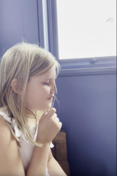 Matilda placing spoon on nose