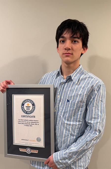 Eric holding record certificate