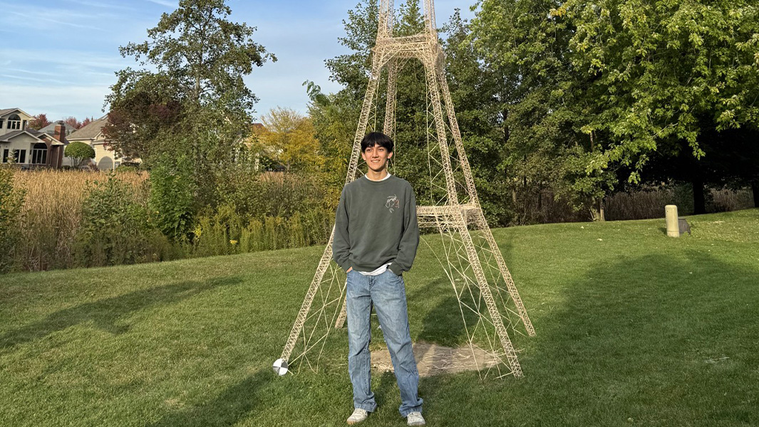 split image Eric working on tower and finished tower