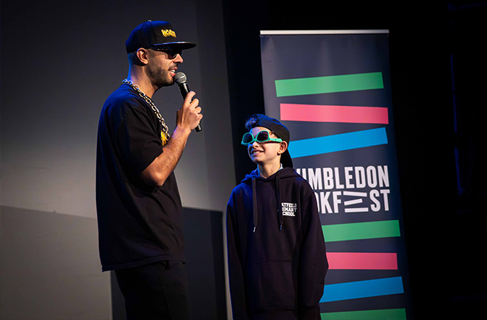 MC Grammar with kid on stage