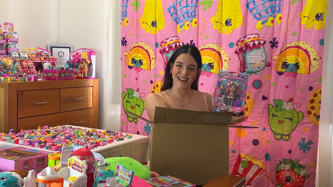 split image kid kicking ball girl showing shopkins