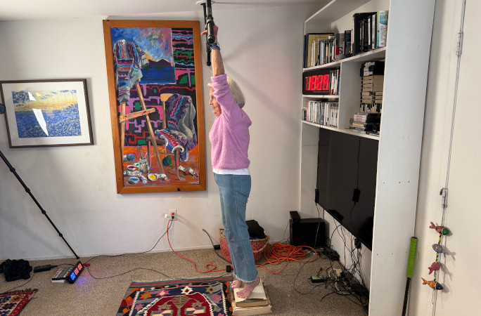 Ann standing on books before attempt