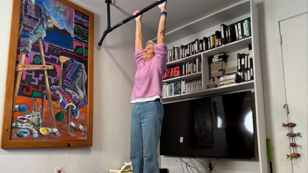 split image Ann doing dead hang showing us hands