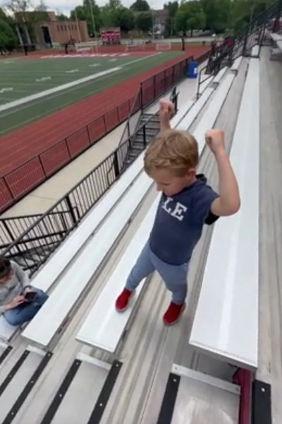 Axel cheering on stairs