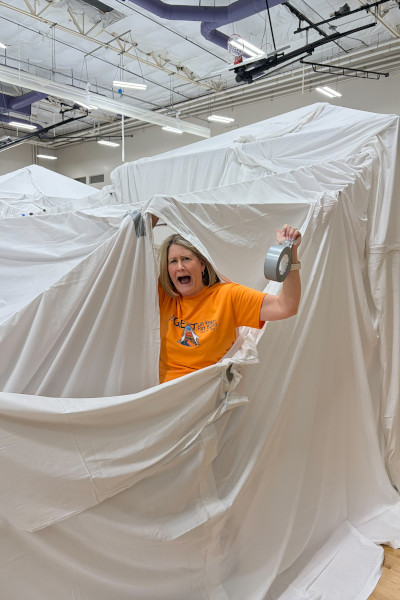 woman trapped in sheets