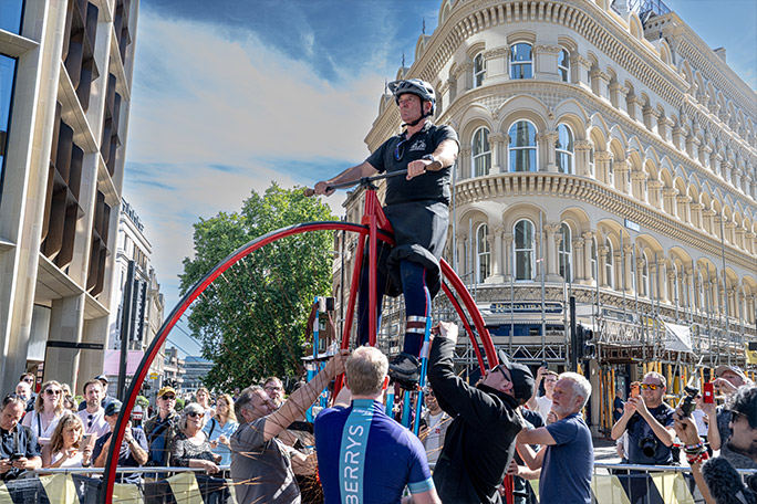 biker riding tallest bicycle