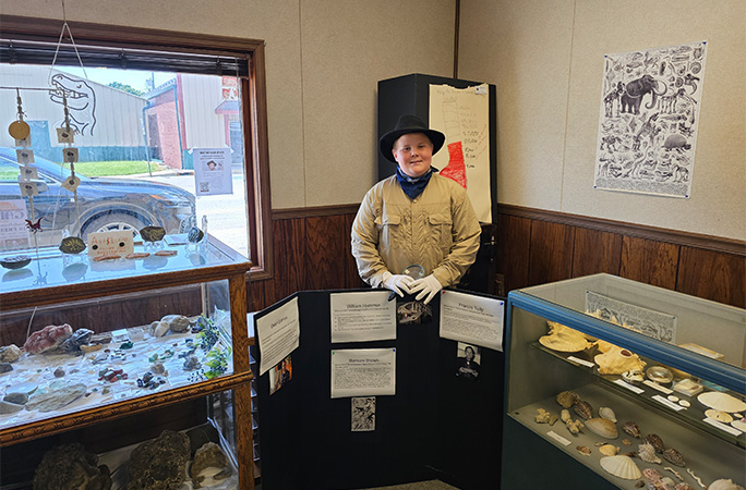 Anderson posing in museum