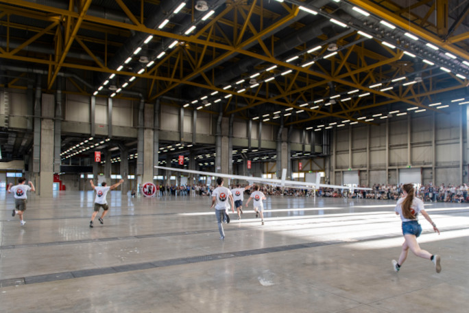 students running with plane