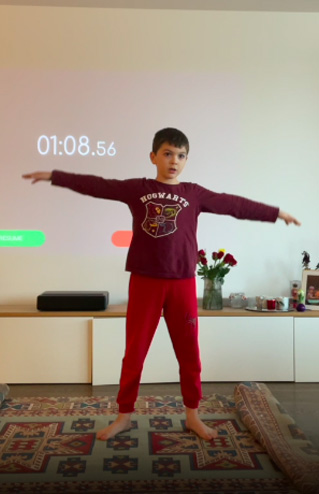 boy doing jumping jacks
