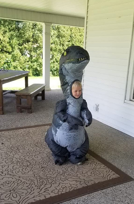 youngest Anderson in dinosaur costume