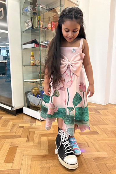 Anvi trying on the former tallest man's Converse shoe