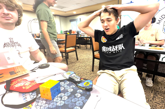 tommy looking at cube shocked