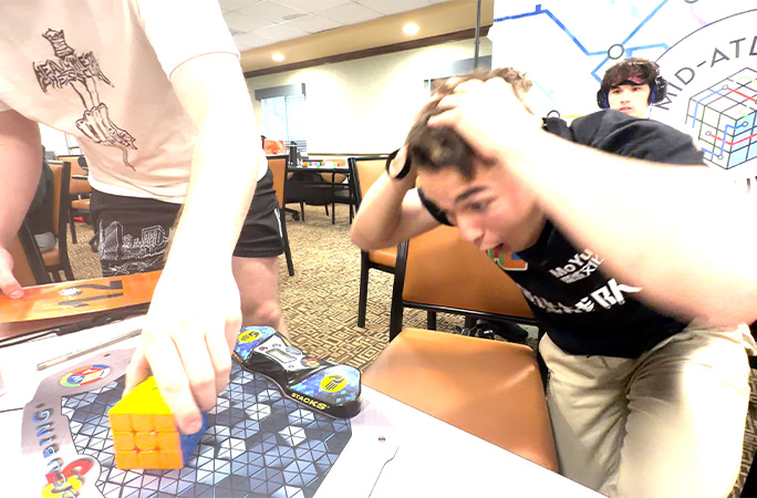 tommy looks at cube screaming