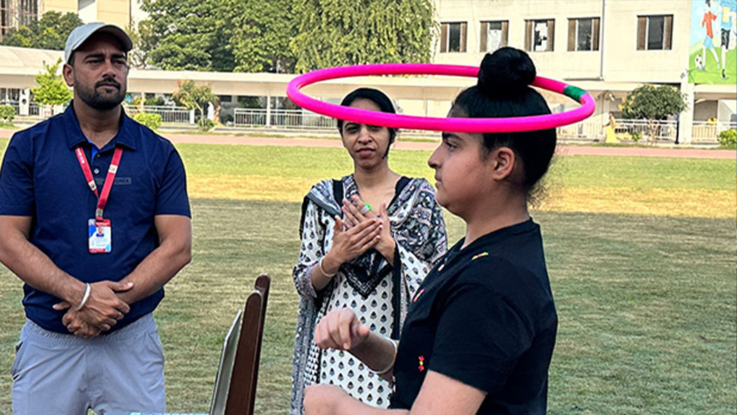 split image Praneet hula hooping on hair bun