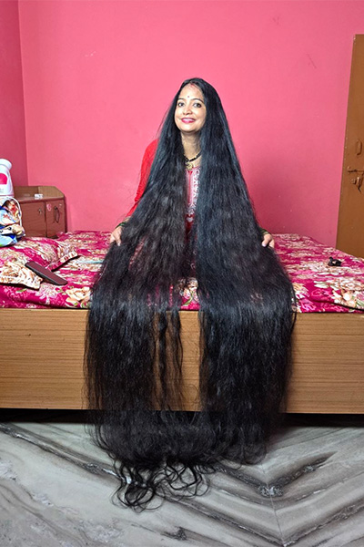 longest hair hanging over bed