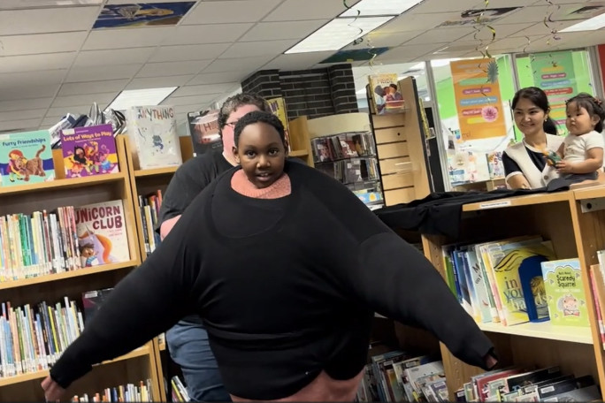 Skyler putting on last sweater