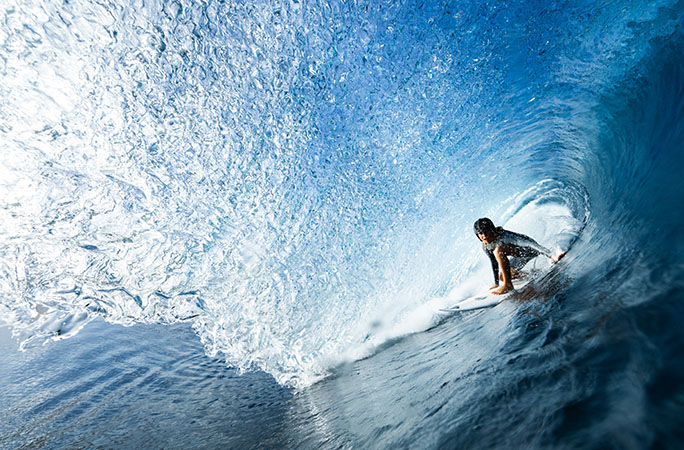 Kelia surfing in a barrel wave